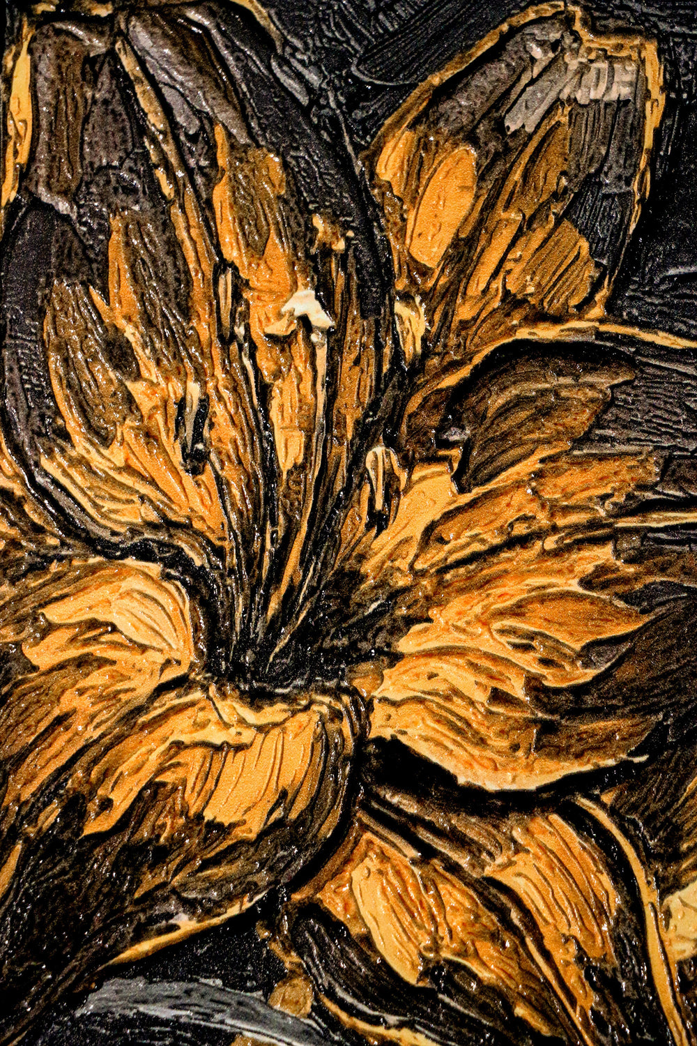 Close-up of a textured surface with floral patterns in brown and black.