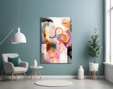 Soft-pink and charcoal cinematic glass wall art over master-bedroom headboard