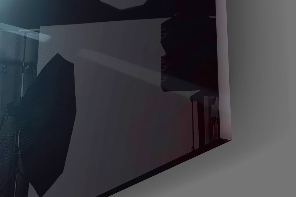 Streetlight-and-figure cinematic glass wall art in boutique-hotel suite