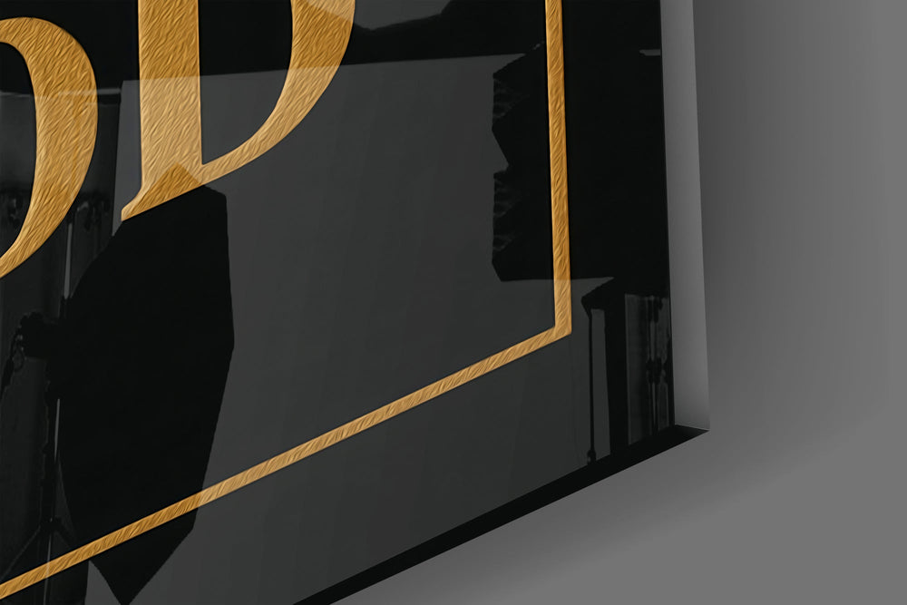 Gold-on-black typography cinematic glass wall art in wine-cellar tasting room