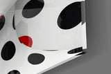 Polka-dot bodypaint cinematic glass wall art in glamorous powder-room