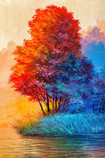 Colorful trees by a body of water with a gradient sky.