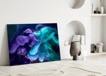 Indigo-and-mint smoke plume glass wall art over master-bedroom headboard