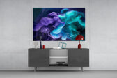 Navy-void colored-plume cinematic glass wall art in designer hallway