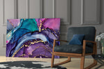 Gold-flecked purple-teal abstract glass wall art over modern dining table