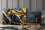 Navy-and-gold impasto abstract glass wall art over modern dining table