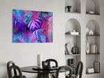Stage-lit neon-jungle glass wall art over master-bedroom headboard