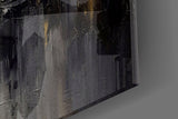 Charcoal-and-ivory feather glass wall art in boutique-hotel lounge