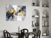 Gold-leaf scatter cinematic glass wall art in luxury powder-room