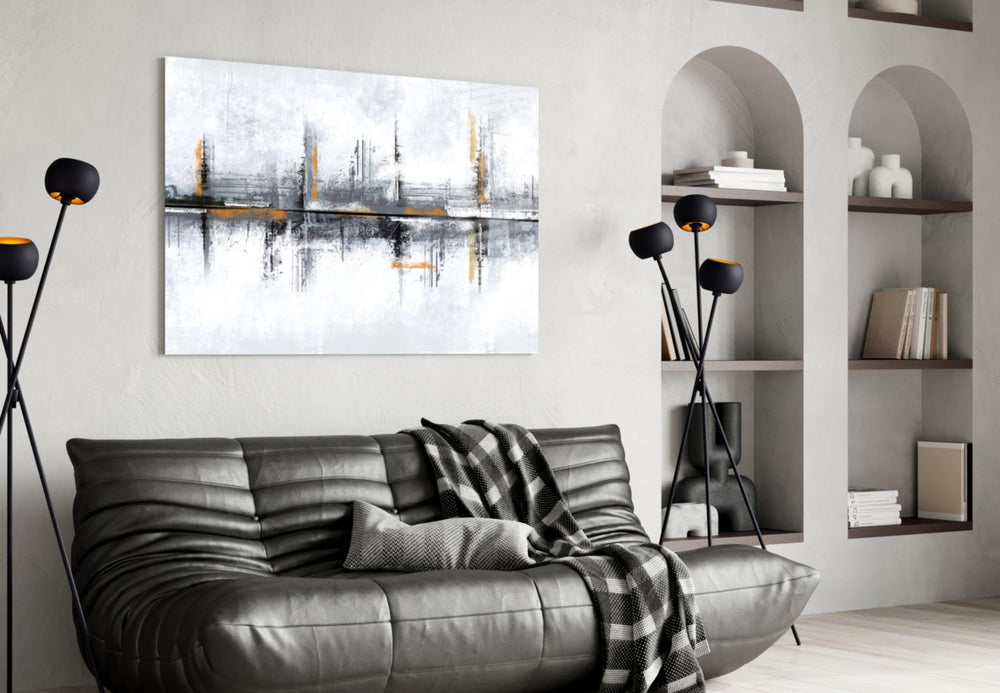 Mirrored-skyline abstract glass wall art in boutique-hotel reception