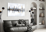 Mirrored-skyline abstract glass wall art in boutique-hotel reception