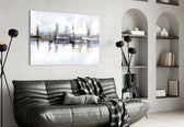 Mirrored-skyline abstract glass wall art in boutique-hotel reception