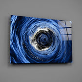 Cobalt sea-swirl glass wall art over walnut console in coastal living room