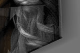 Selective-color woman cinematic glass wall art beside dressing table in boutique-hotel suite