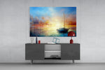 Painterly sunset sailboat glass wall art in resort suite living room