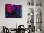 Stage-lit palm-fan cinematic glass wall art over master-bedroom headboard