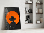 Black-and-orange cinematic glass wall art over modern dining sideboard