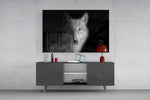 Lone-hunter cinematic glass wall art in boutique-hotel lounge