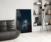 Rain-slick road cinematic glass wall art over modern dining sideboard