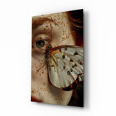 Freckled eye butterfly wing cinematic glass wall art over walnut console in designer fashion atelier