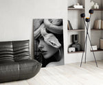B&W muse-with-snake cinematic glass wall art over modern dining sideboard