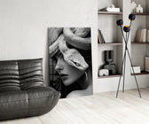 B&W muse-with-snake cinematic glass wall art over modern dining sideboard