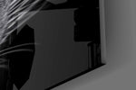 Half-lit panther cinematic glass wall art in steakhouse private dining room