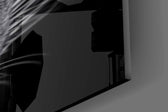 Half-lit panther cinematic glass wall art in steakhouse private dining room