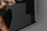 Goddess archetype cinematic glass wall art in wellness clinic