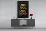 Matte-black gold cinematic glass wall art in light-filled atelier