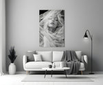 Helmut-Newton style cinematic glass wall art in heritage stairwell