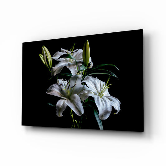 White lily trio cinematic glass wall art over walnut console in designer bedroom